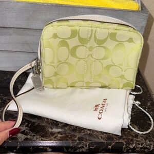 Coach Chartreuse Signature Wristlet with metal hang tag and Coach dust bag